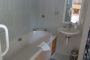 en suite bathroom with bathtub