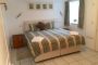 double bedroom with TV and en suite bathroom