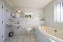 bathroom en suite with spa bath